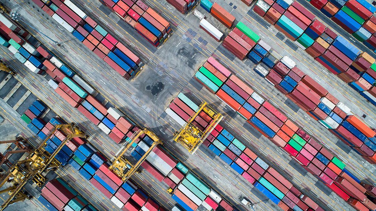 Aerial view of around a hundred of containers in a port