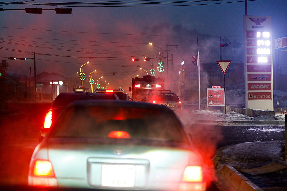 Traffic jam on a small road at night