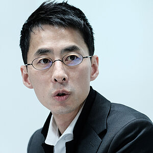 a Korean man with eye-glasses