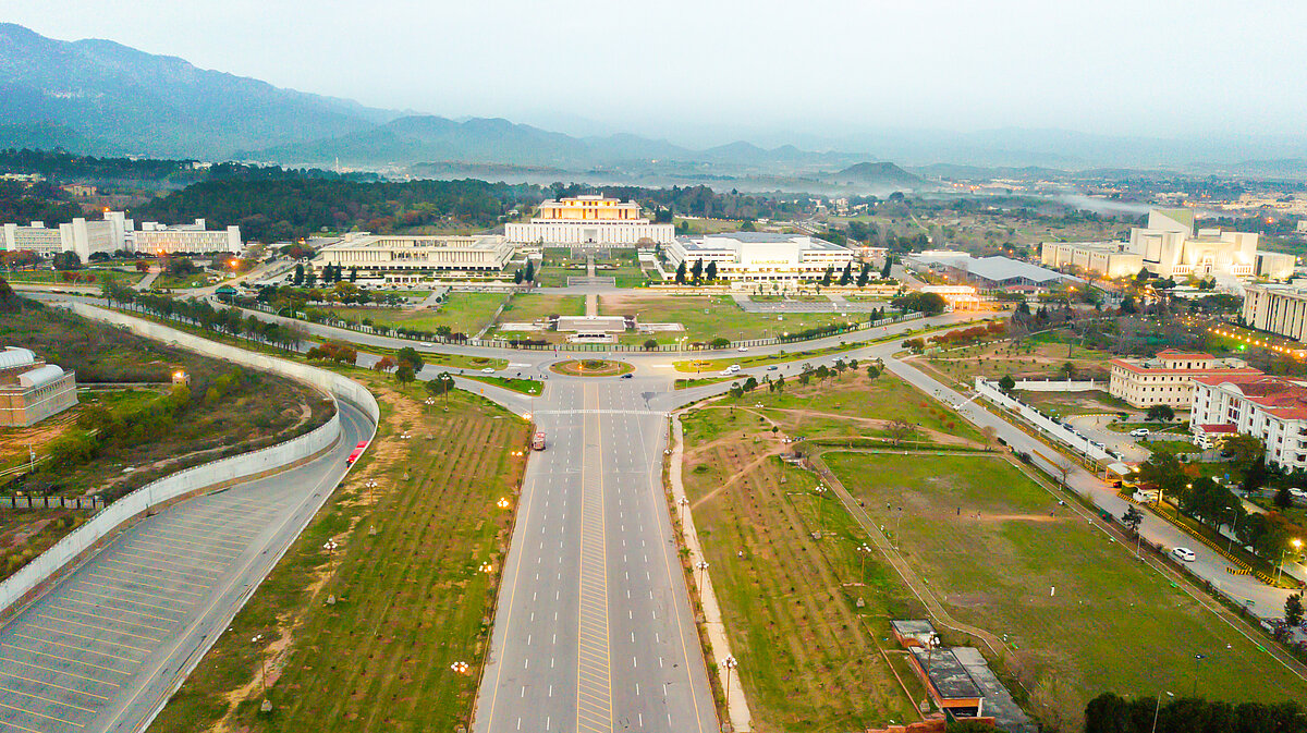 Aerial view of government buildings with mountain in the back
