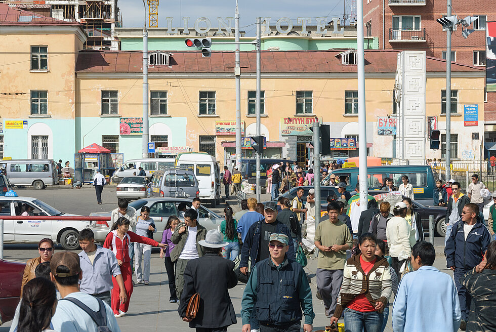Pedestrians and vehicles at an intersection in city of Ulaanbaatar, Mongolia 