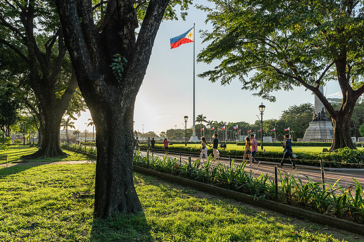 Visitors taking an afternoon stroll at Rizal Park, Manila.