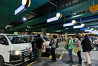 Commuters queue as they wait to board a UV Express van in a PUV terminal at SM North EDSA, Quezon City. 