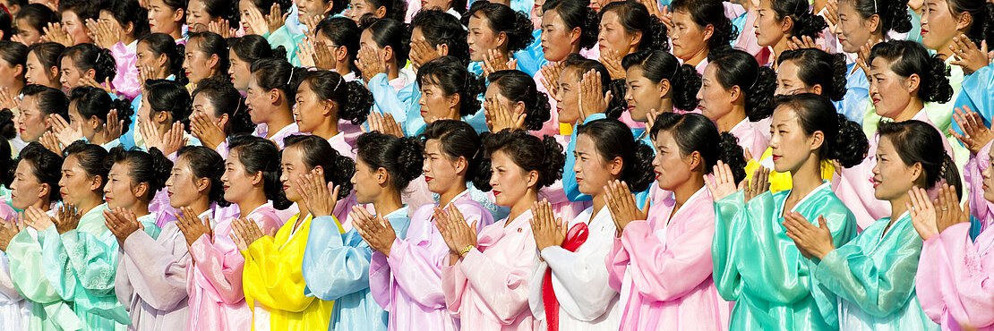 Pyongyang, North Korea - A group of female performer are rehearsaling in front of Juche Tower, the landmark of Pyongyang.