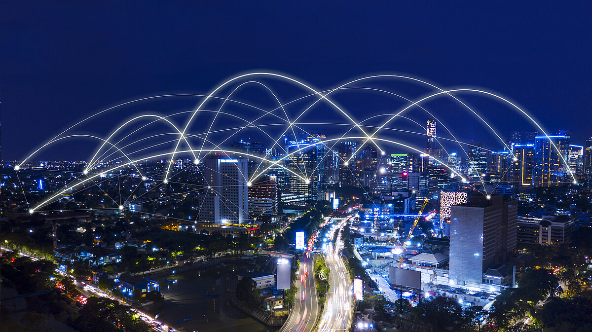 Aerial view of beautiful Jakarta cityscape with connection network at night time