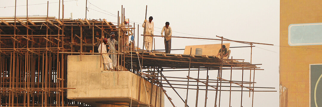 A group of workers at a bridge construction site