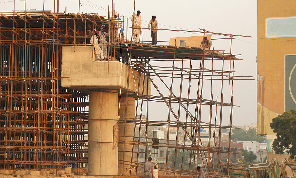 A group of workers at a bridge construction site