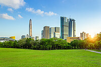Cityscape of Shenzhen, China with large green area and skyscrapers background