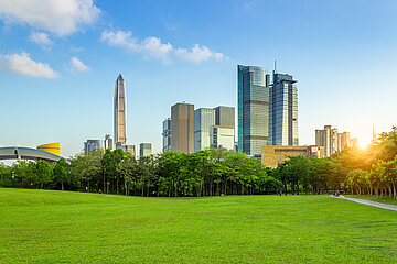 Cityscape of Shenzhen, China with large green area and skyscrapers background
